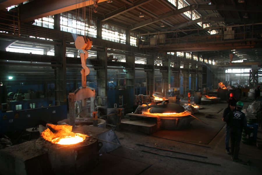Glowing furnaces on a foundry floor