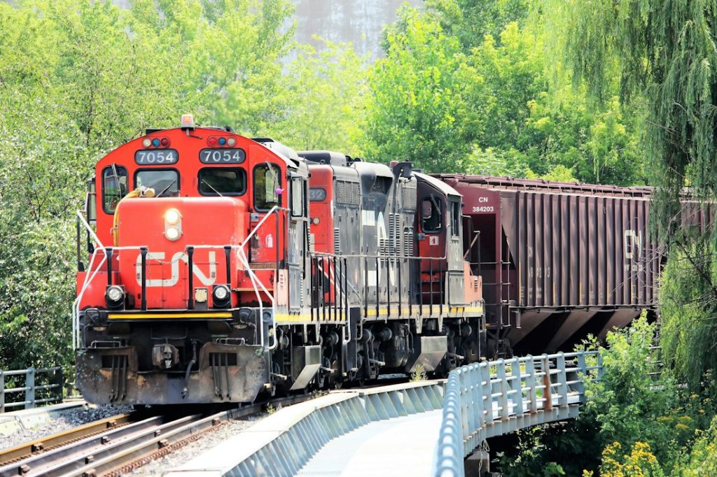 Red freight locomotive on a bridge