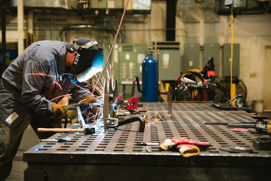 Welder at a fixture table