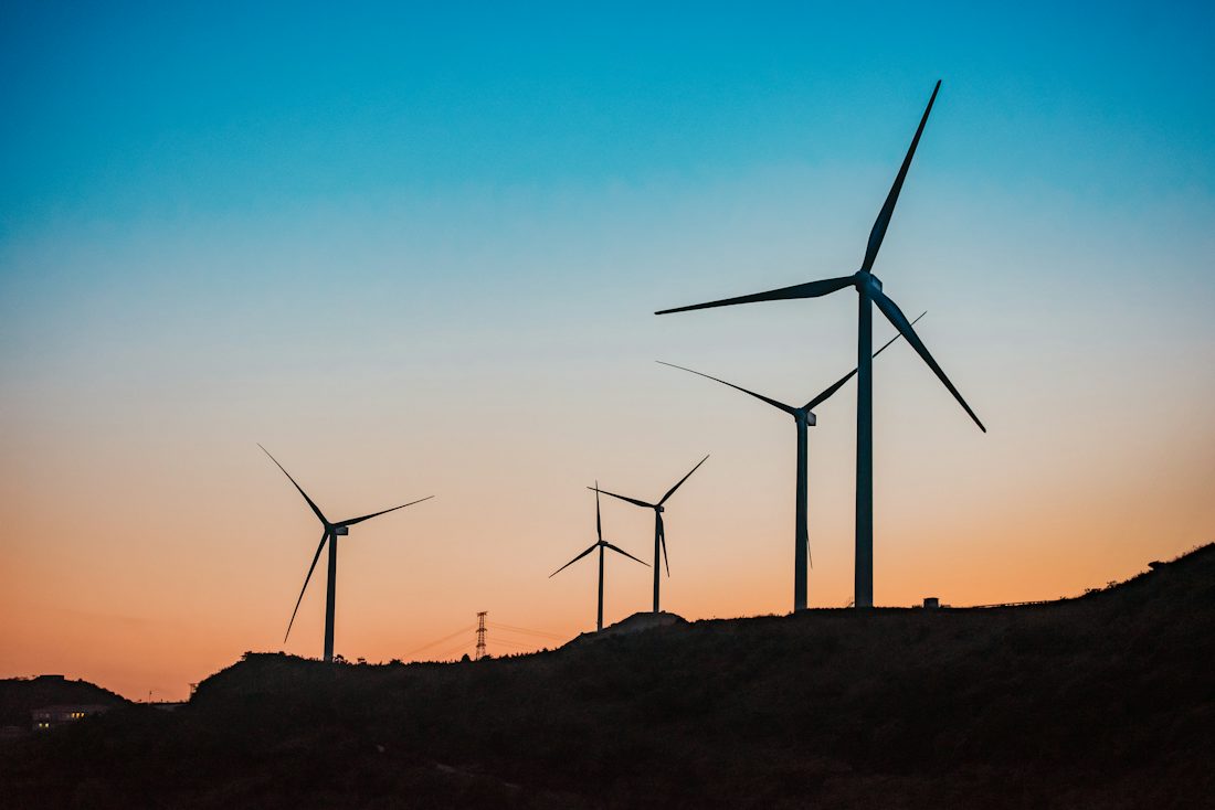 Wind turbines at sunset